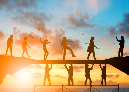 A group of people standing on top of a bridge.